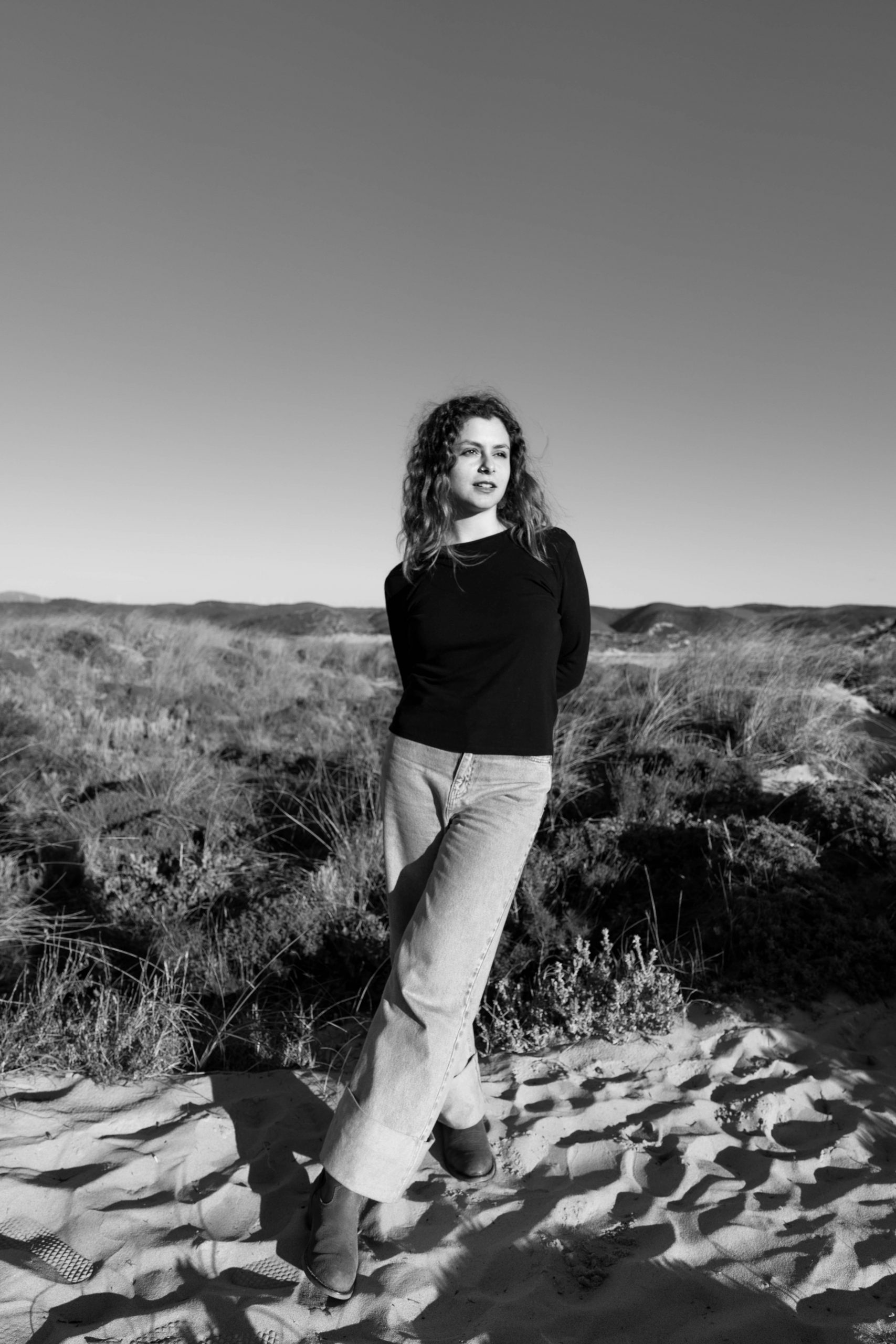 Woman standing in the dunes