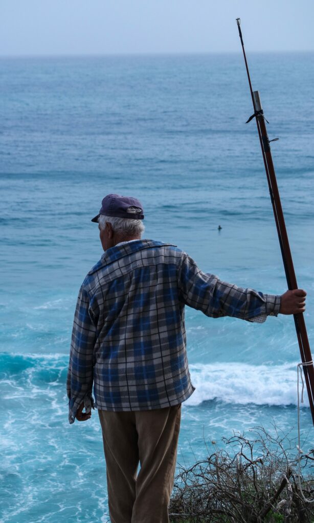 Pescador experiente e a sua cana